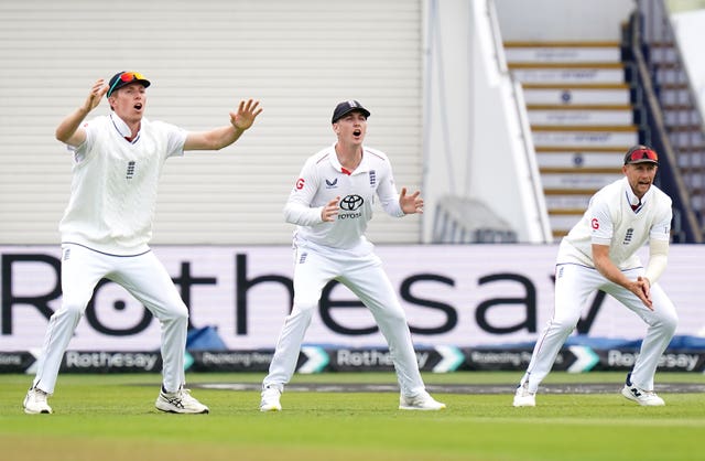 England’s Zak Crawley (left), Harry Brook and Joe Root (right) on day three