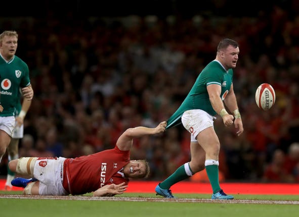 Wales’ Bradley Davies (left) fails to stop Ireland’s Dave Kilcoyne