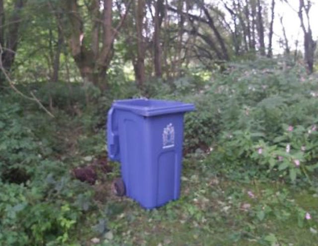 The blue wheelie bin found in the cemetery 