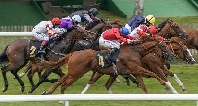 Ametist (red silks/blue cap) winning The Join The Great Racing Welfare Cycle Handicap at Newmarket