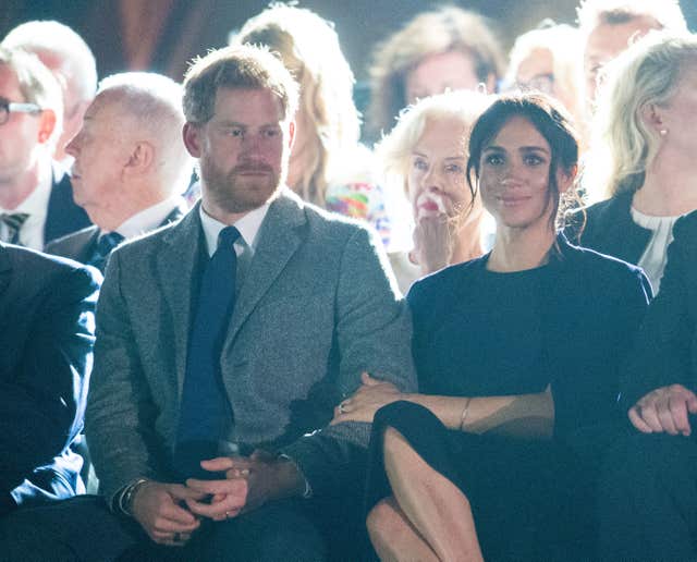 Harry and Meghan sitting side by side