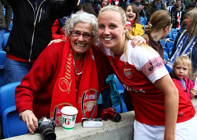 Beth Mead celebrates with a life long Arsenal fan