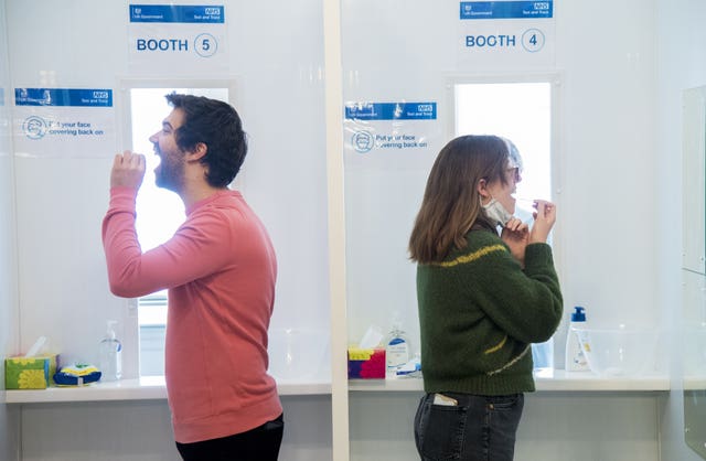 Members and employees of the English National Opera take part in the Government’s Covid-19 rapid screening programme using government supplied lateral flow tests (Ian West/PA)