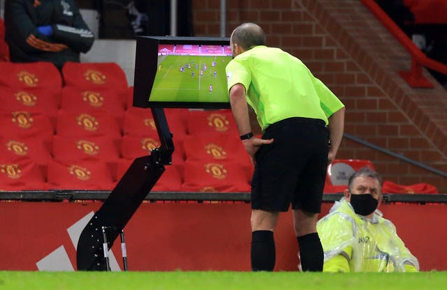 Mike Dean reviewed the Jan Bednarek challenge on Anthony Martial using the pitchside monitor 