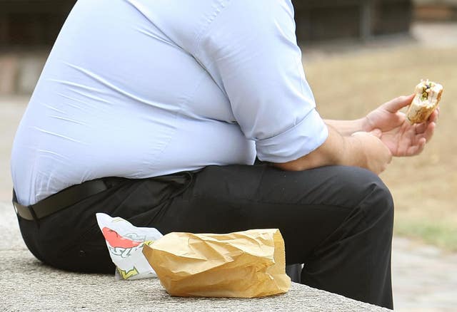 Overweight person eating
