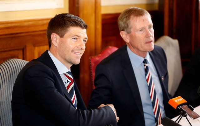 Rangers manager Steven Gerrard, left, shakes hands with chairman Dave King 
