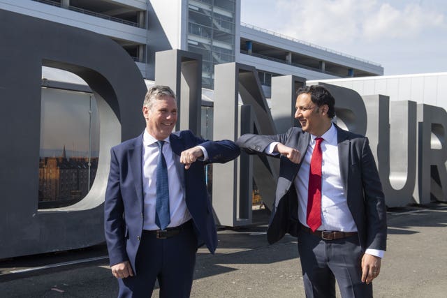 Keir Starmer and Anas Sarwar bumping elbows