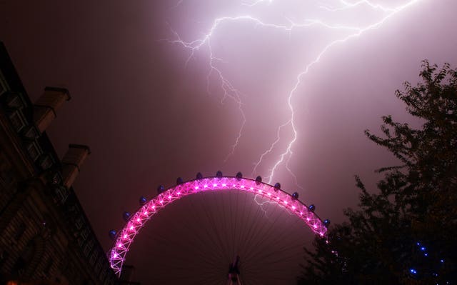 Lightning strikes behind The London Eye