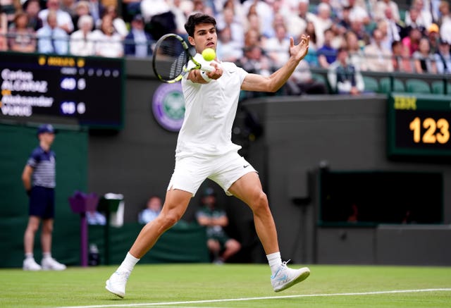 Carlos Alcaraz hits a forehand on his way to victory
