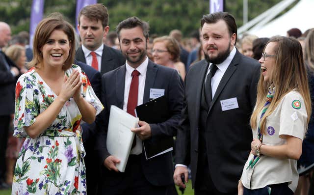 Princess Eugenie (left), laughs as she meets actor John Bradley (Kirsty Wigglesworth/PA)