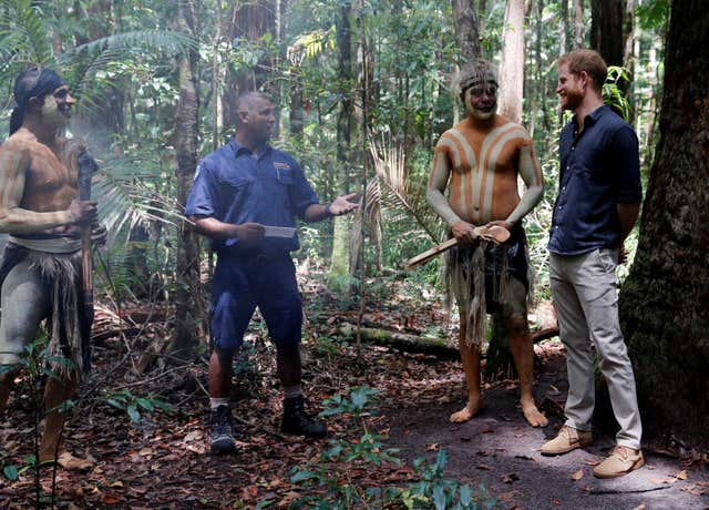 The Duke of Sussex stands next to Butchulla People during a dedication ceremony of the forests of K'gari to the Queen's Commonwealth Canopy on Fraser Island (Phil Noble/PA)