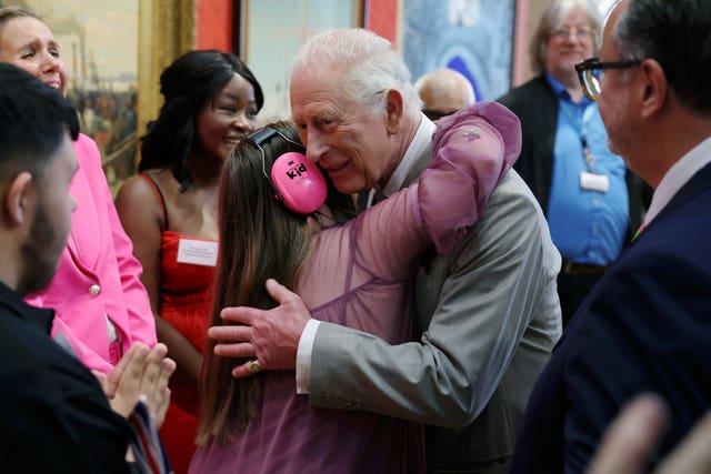 Charles is hugged by Florence McGrellis, 15