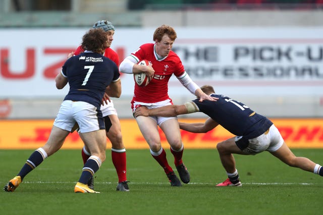 Harris puts in a tackle on Rhys Patchell during the Six Nations match at Parc y Scarlets