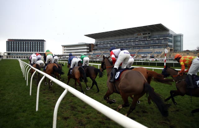 The field pass the empty grandstand at Doncaster earlier this week