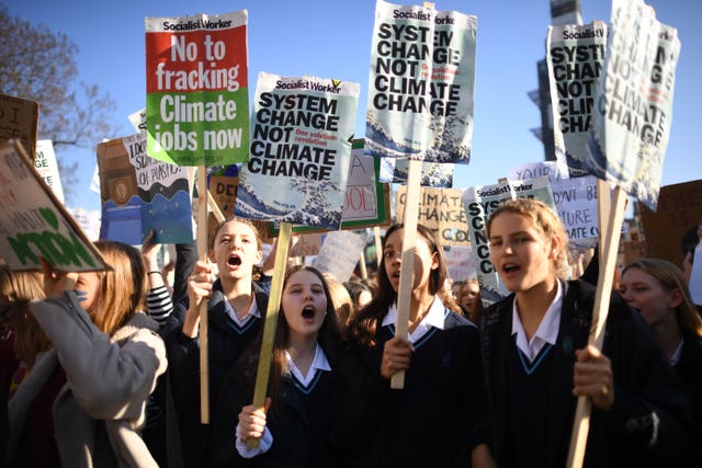 Students from the Youth Strike 4 Climate movement during a climate change protest in Parliament Square, Westminster 