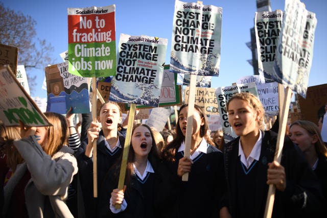 Students from the Youth Strike 4 Climate movement during a climate change protest in Parliament Square, Westminster
