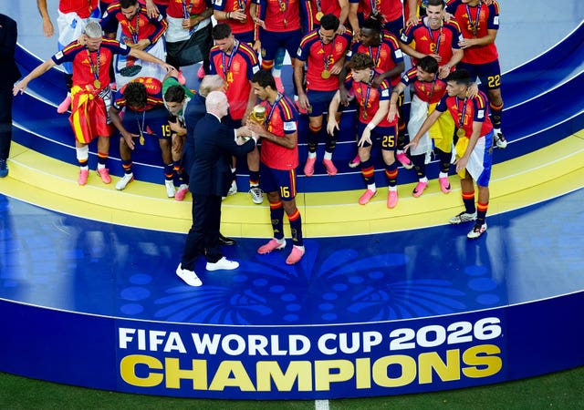 FIFA president Gianni Infantino presents the World Cup trophy to Spain