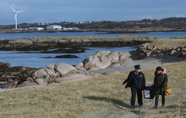 A ballot box is carried on Inishfree Island off the coast of Co Donegal ahead of a previous poll (Brian Lawless/PA)