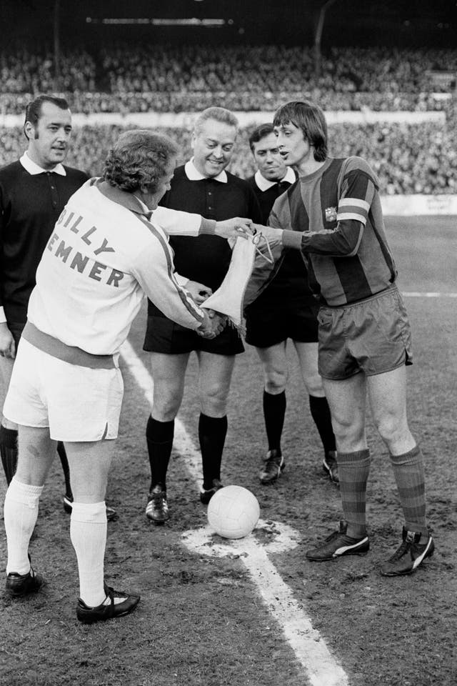 Barcelona captain Johan Cruyff (right) swaps pennants with Leeds captain Billy Bremner before the European Cup semi-final, first leg clash between the sides in April 1975