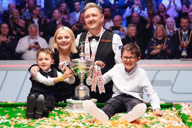 Kyren Wilson celebrates with his family at the Crucible
