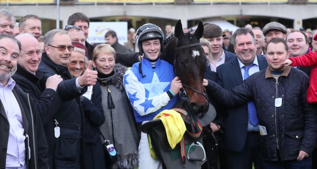 Kemboy with David Mullins and members of the Supreme Horse Racing Club