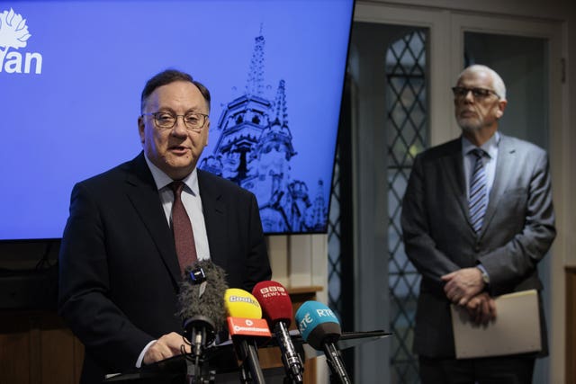 Dr Trevor Gribben, left, speaks to the media during a press conference in November