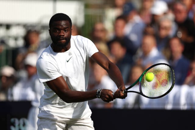 Frances Tiafoe in action against Novak Djokovic