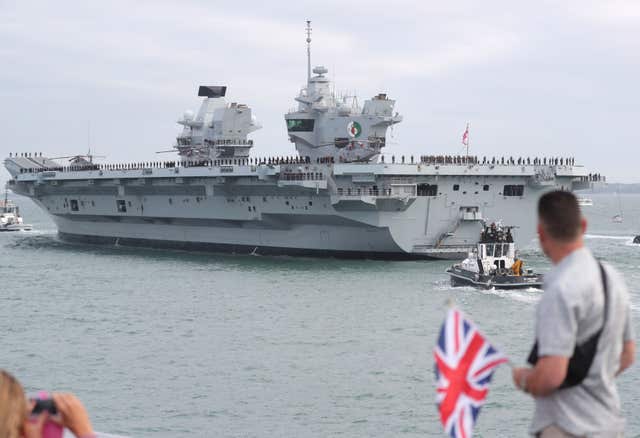 HMS Queen Elizabeth will deploy to the Middle East and Pacific on her maiden operational mission (Steve Parsons/PA)