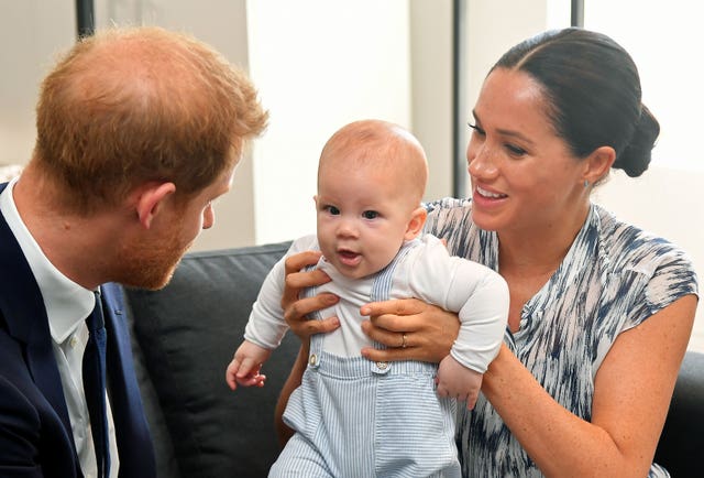 The Duke and Duchess of Sussex holding their son Archie during a meeting with Archbishop Desmond Tutu in South Africa in 2022