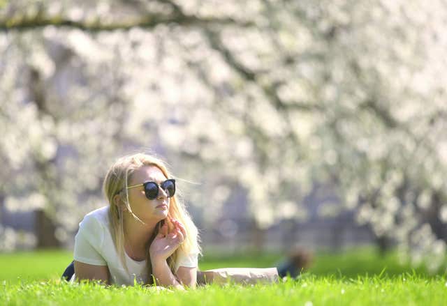 Soaking up the rays in London's Green Park (Victoria Jones/PA) 