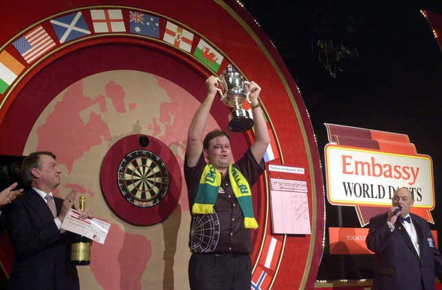 Raymond Van Barneveld celebrates with the trophy after winning the 2003 world title against Ritchie Davies