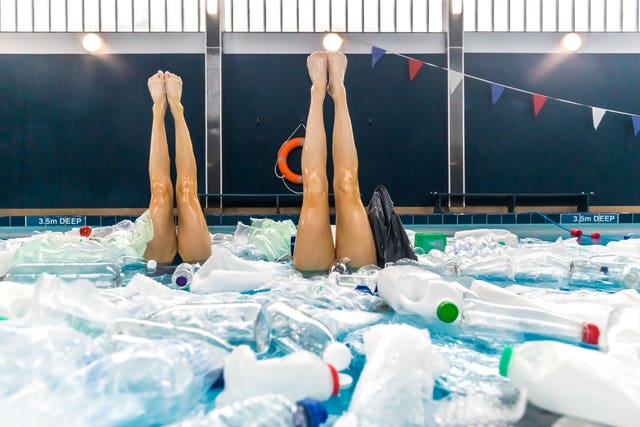 Kate Shortman and Isabelle Thorpe perform in a swimming pool full of plastic