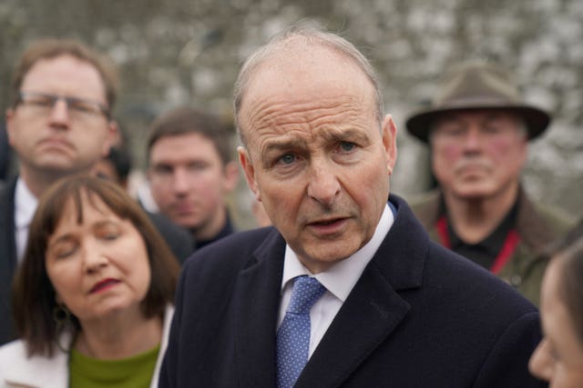 Micheal Martin speaking to media at a cemetery