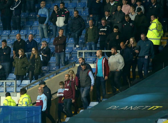 West Ham fans leave the stadium after their side go three goals down