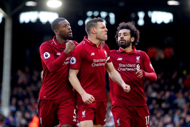 James Milner celebrates his spot-kick winner