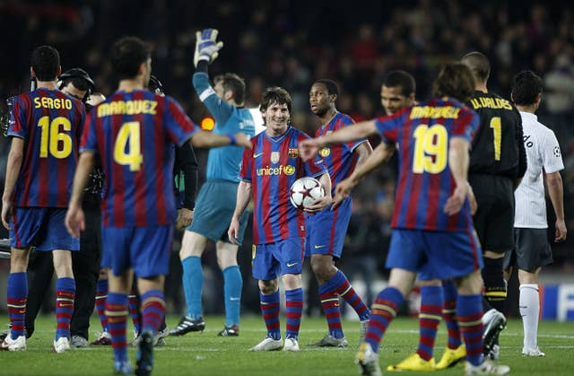Lionel Messi, centre. with the match ball after scoring four against Arsenal