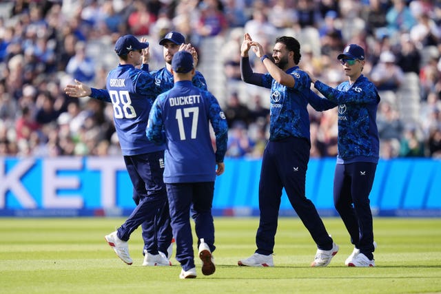 Saqib Mahmood, second right, celebrates a wicket