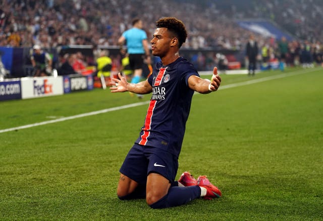 Desire Doue celebrates by sliding on his knees