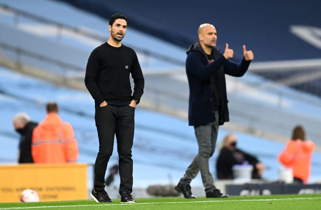 Arsenal manager Mikel Arteta. left, came away empty-handed against his former boss Pep Guardiola
