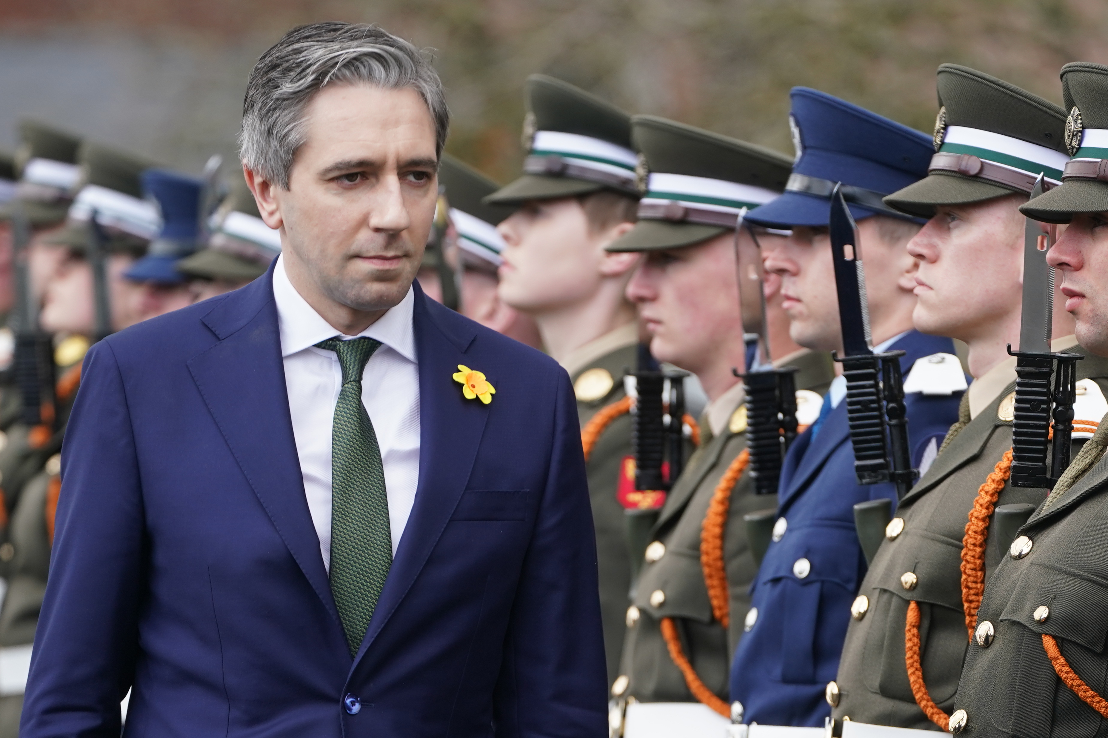Tanaiste and Minister for Defence Simon Harris inspects a guard of honour as he attends the commissioning ceremony of the 100th cadet class & the 12th potential officers class, at the Defence Forces Training Centre, in Curragh, Co Kildare