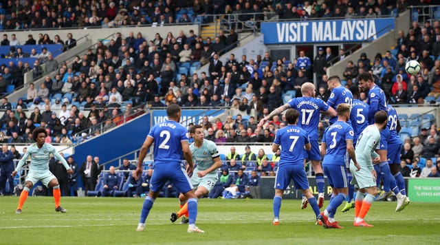 Willian, left, sends a free-kick wide
