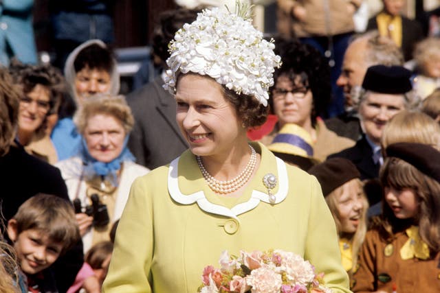 The Queen in a white floral decked hat during her visit to the Isle of Man in 1972 (PA)