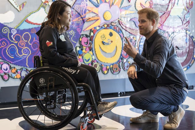 The Duke of Sussex is greeted by powerlifter Eri Yamamoto