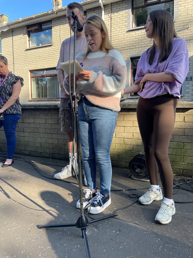 Ainsley White speaks during a vigil in Donaghadee, Co Down, in memory of her best friend, Sarah Montgomery