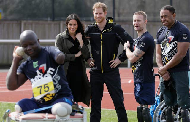 Prince Harry and Meghan Markle meet athletes (Kirsty Wigglesworth/PA)