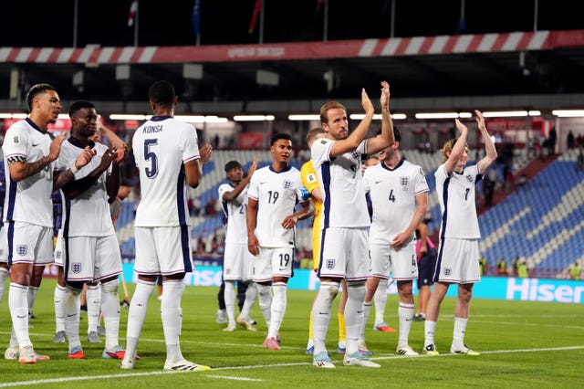 Harry Kane, centre, and England applaud their fans following the World Cup qualifying win in Serbia