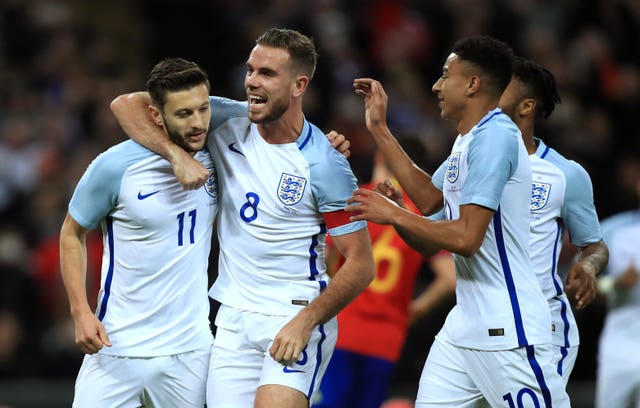 Adam Lallana (left) scored an early penalty as England drew 2-2 with Spain in a 2016 friendly