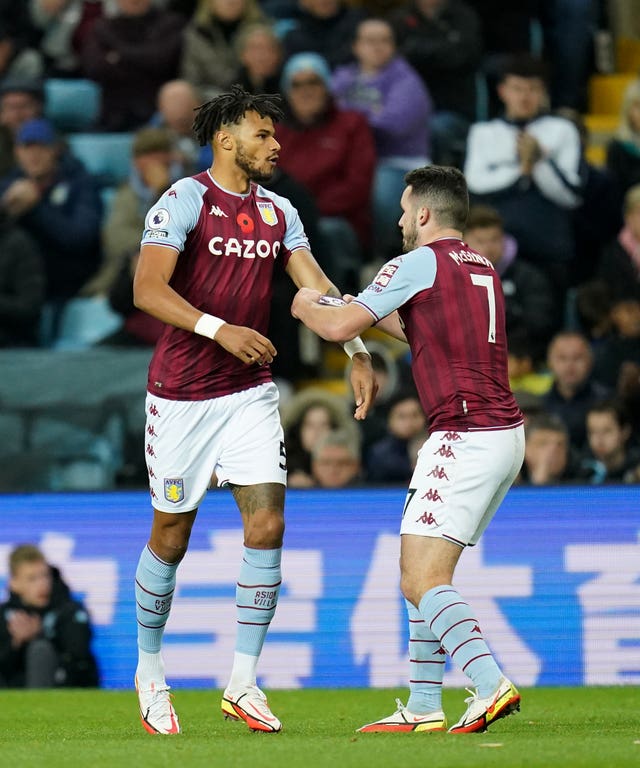 Tyrone Mings, left, is given the captain’s armband by John McGinn after coming on as a substitute