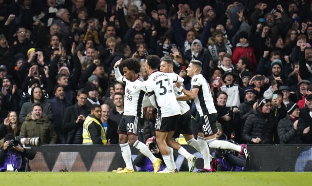 Willian, left, refuses to celebrate against his former side