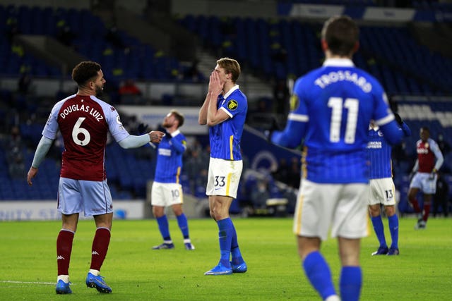 Dan Burn, centre, reacts to Martinez's save which denied his first Brighton goal